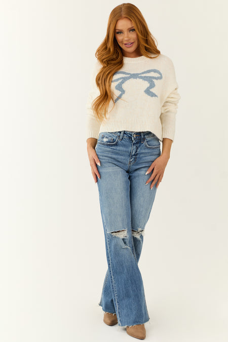 Cream and Steel Blue Ribbon Graphic Sweater