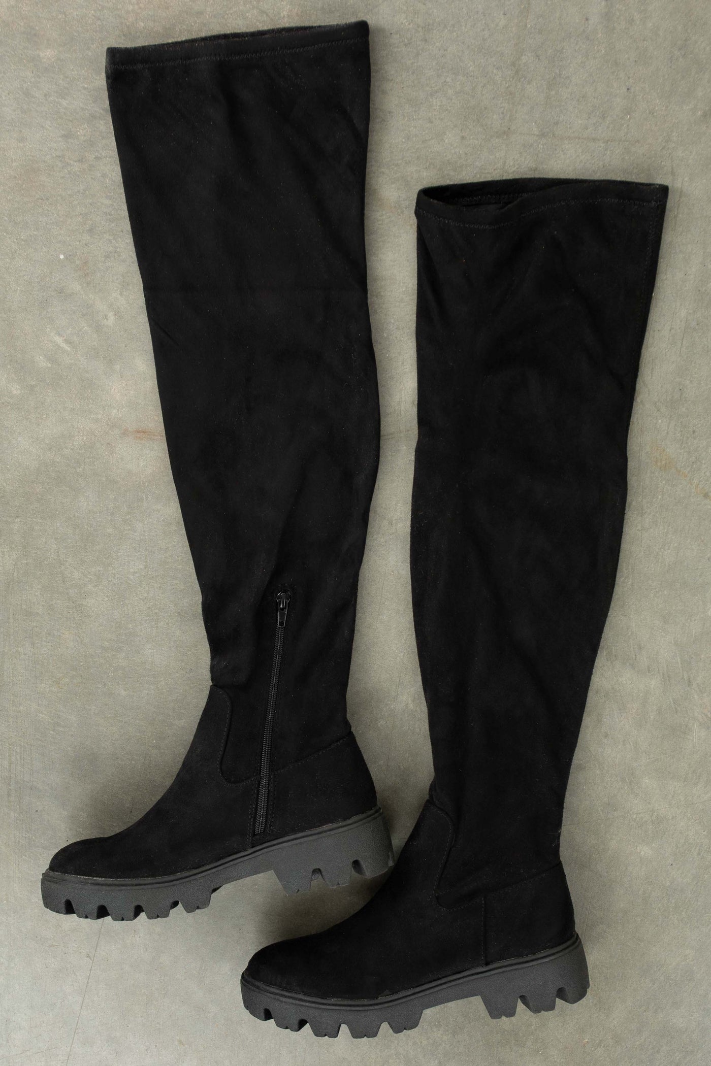 black cleated sole over the knee boots