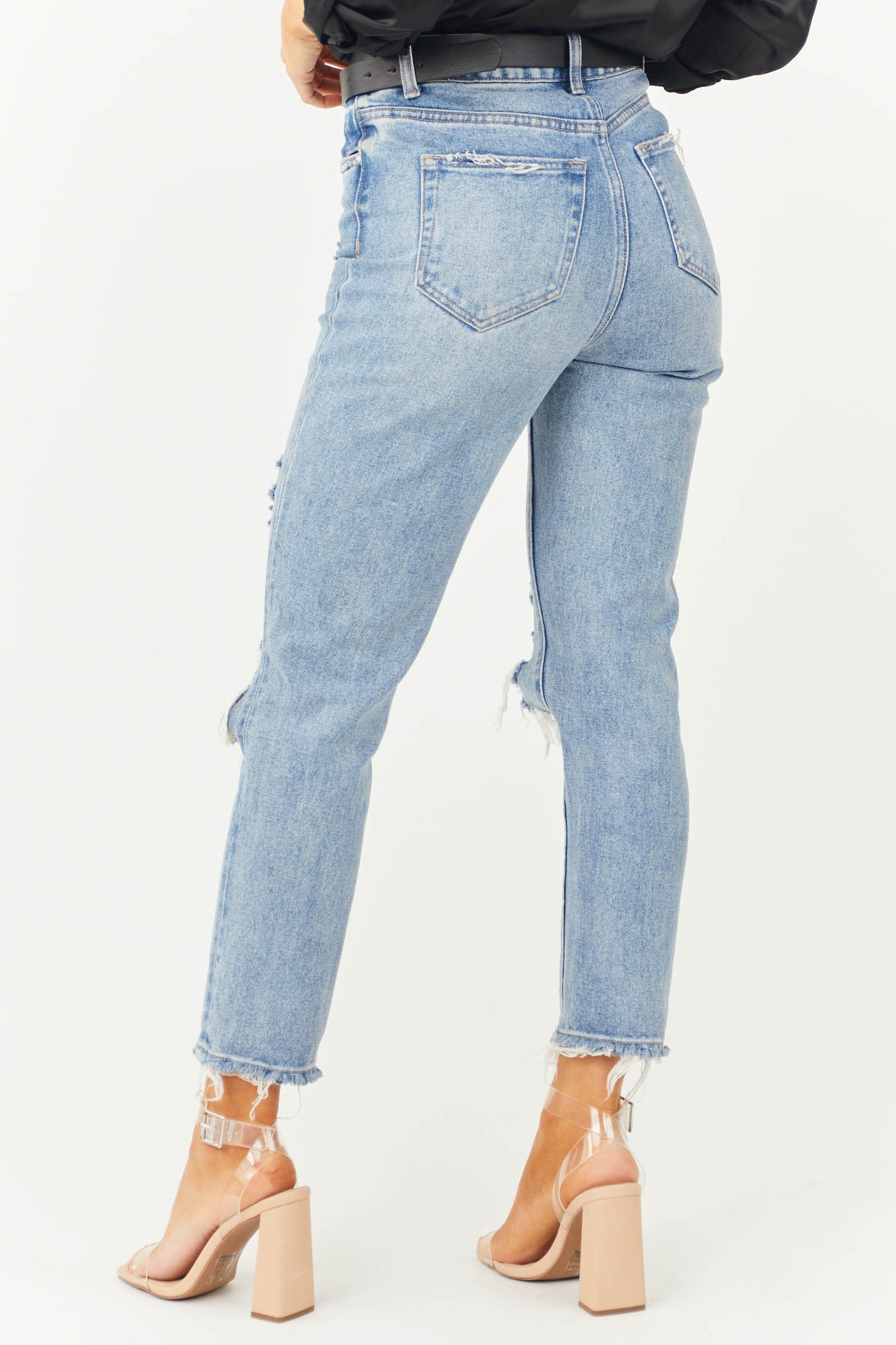 https://www.limelush.com/cdn/shop/products/Medium-Wash-Frayed-Hem-Distressed-Mom-Jeans-back-view_01182023.jpg?v=1674504830&width=1400